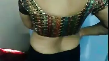 Indian aunty puts on her sari 